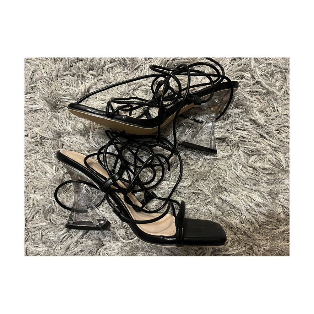 Tie leg design clear pyramid heeled Gladiator sandals in black. Brand new!!